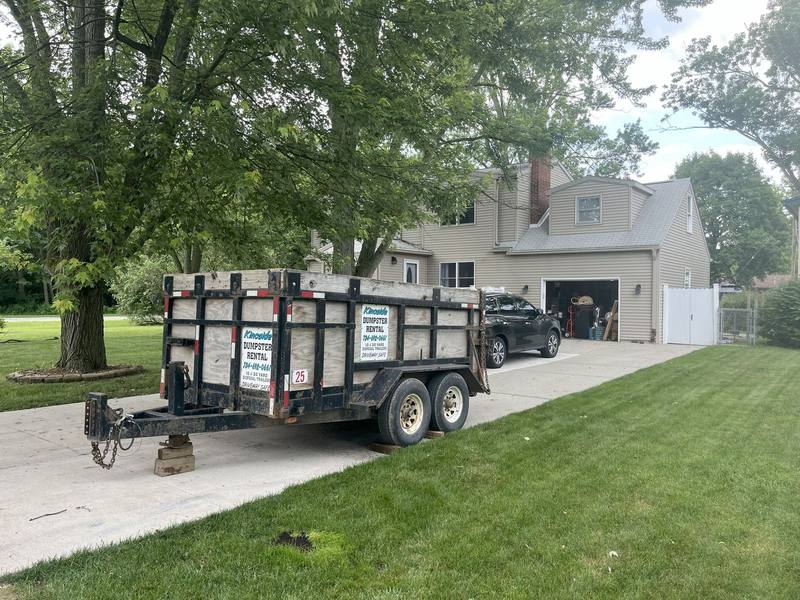 Kincaide Dumpster Rental trailer in a customer driveway