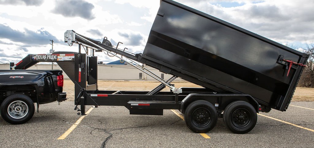 Kincaide roll off dumpster trailer tipped up to unload